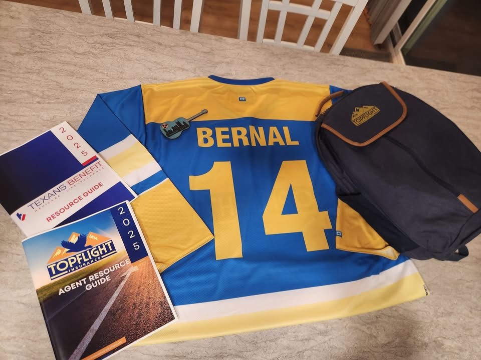 Topflight agent welcome kit with branded jersey, backpack, and 2025 Agent Resource Guide